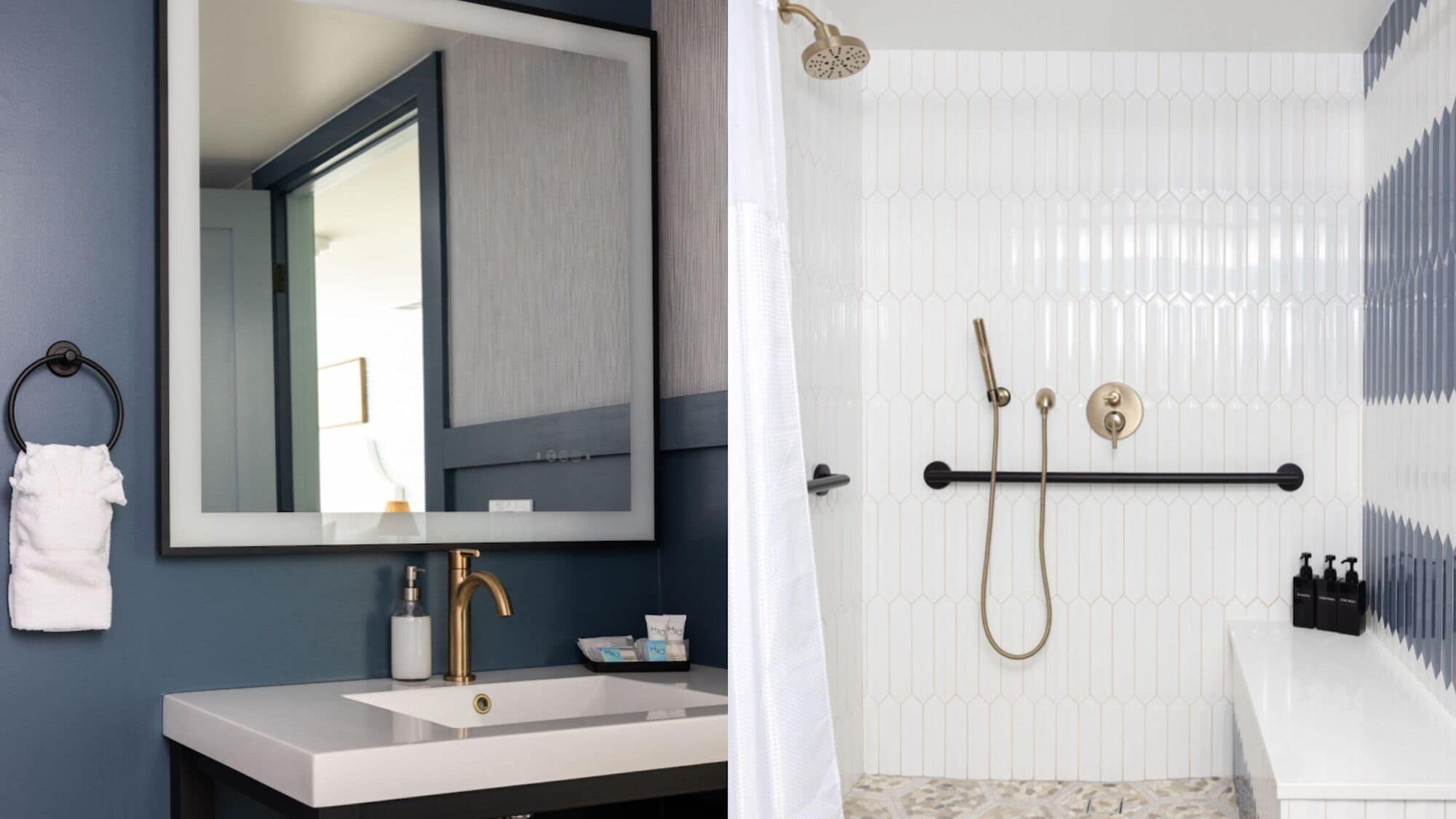 A bathroom with a large mirror, a gold faucet, a white sink, a shower with a gold showerhead, and a towel rack.