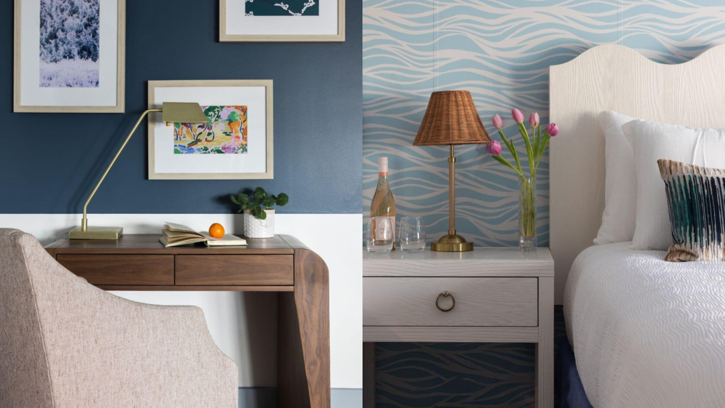 A bedroom with a bed, bedside table, lamp, and wall art.