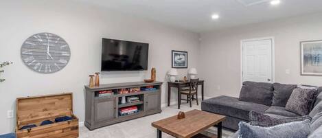 Smart TV, fireplace, foosball, books