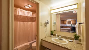 Bathtub, hair dryer, towels, soap