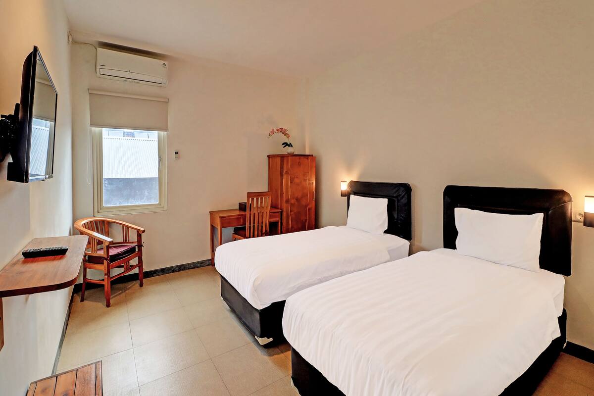 Habitación Deluxe con 2 camas individuales | Wifi gratis y ropa de cama