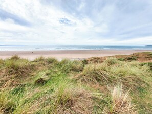 A beach with dunes and the ocean in the background. - Only 4 miles from Westward Ho. (Littleham, near Bideford)