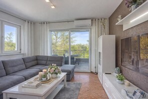 Family Apartment, Multiple Bedrooms (Sea Breeze Residence Mariella) | Living area | TV