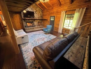 Smart TV, fireplace, books, offices