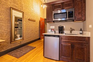 Fridge, microwave, coffee/tea maker, cookware/dishes/utensils