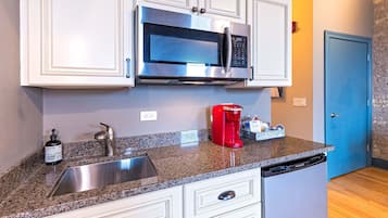 Fridge, microwave, coffee/tea maker, cookware/dishes/utensils