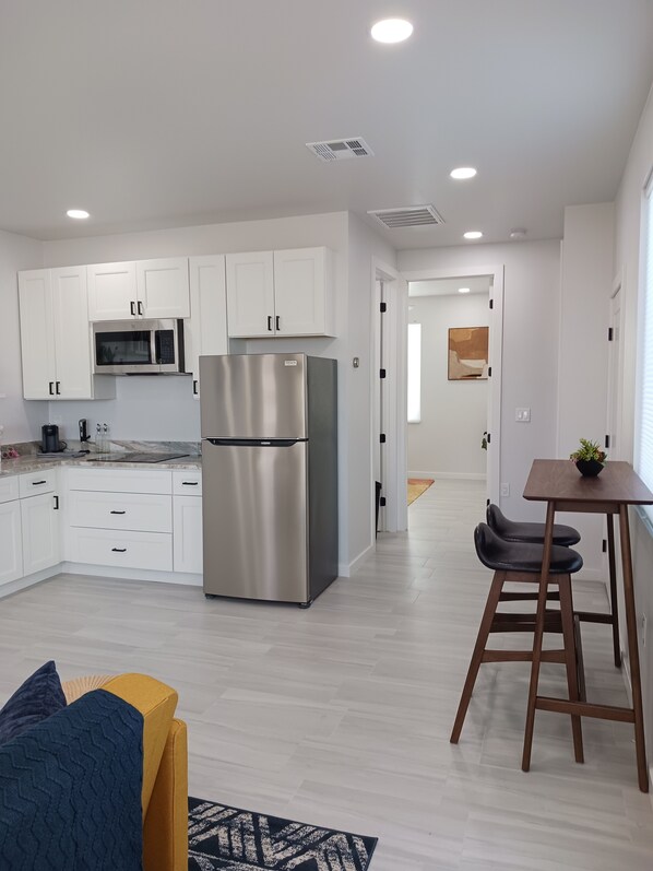 Fridge, microwave, stovetop, coffee/tea maker