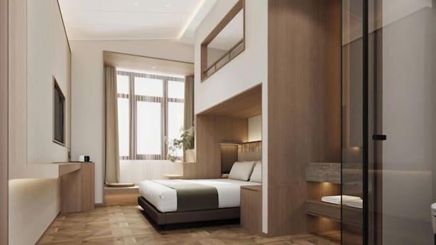 A modern bedroom with a bed, bedside table, and a large window. - Greater Khingan Tahe Chengxin Business Hotel (Tahe)