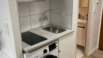 Fridge, stovetop, coffee/tea maker, cookware/dishes/utensils