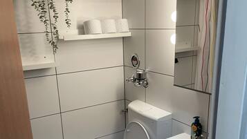 Shower, towels, soap, toilet paper