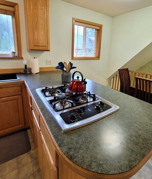 Fridge, microwave, stovetop, coffee/tea maker