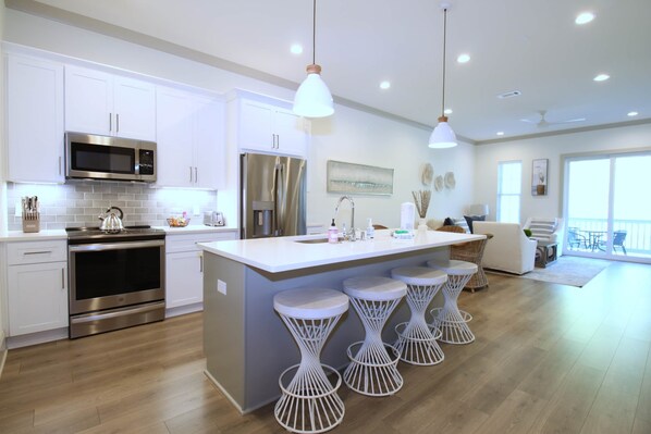 Enjoy meals in the kitchen with a central island and bar stools, and dine with a view of the outdoors.