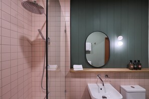 Deluxe Room | Bathroom | Designer toiletries, hair dryer, bathrobes, towels