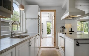 Fridge, stovetop, dishwasher, coffee/tea maker