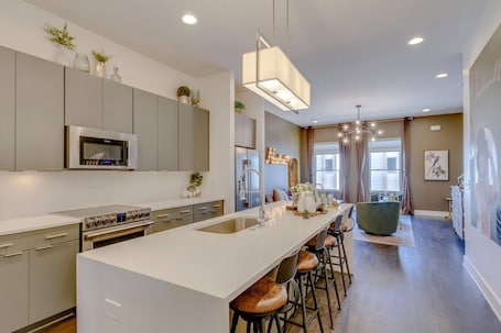 Fridge, microwave, oven, stovetop. Modern Townhome with Gorgeous Patio Space