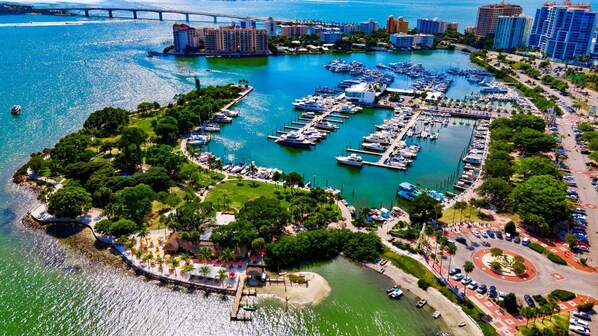 Enjoy waterfront views of the marina surrounded by lush greenery and trees.