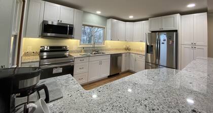 Newly Remodeled Brick Home with wall Sculptures by the Airport