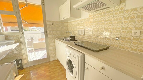 Fridge, coffee/tea maker, toaster, cookware/dishes/utensils