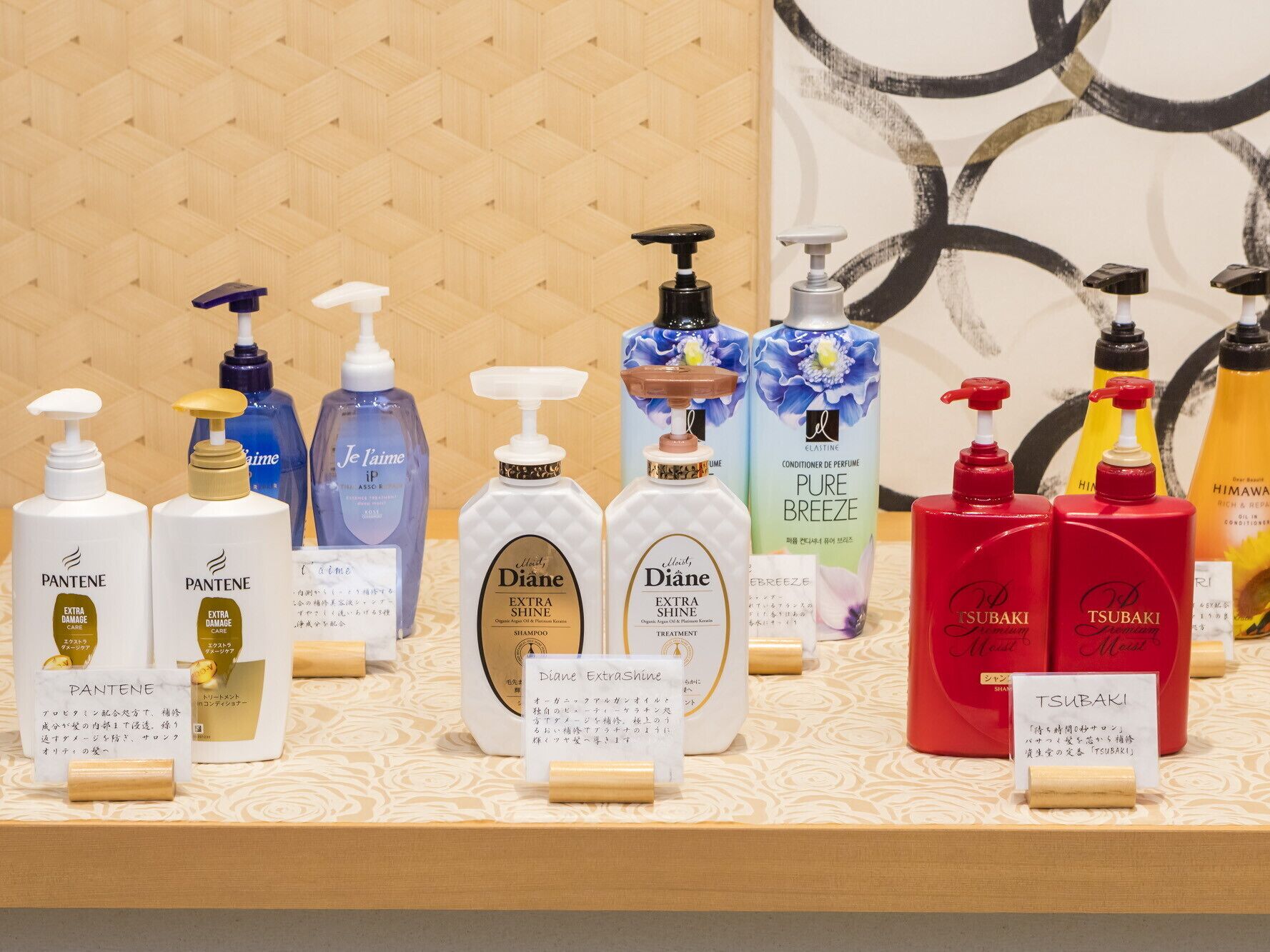 A display of various personal care products on a table with labels and price tags.