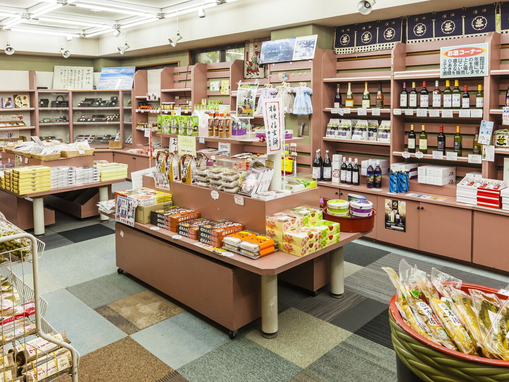 A store with various packaged goods, including snacks and beverages, displayed on shelves and counters.