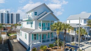 A two-story beachfront house with a balcony, a pool, and palm trees. - Tidepool by Avantstay 2min Walk to Miramar Beach! (Miramar Beach)