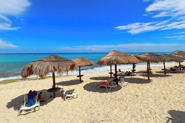 On the beach, sun loungers