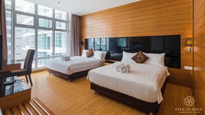 A hotel room with two beds, a desk, and a large window. - Dua Sentral Kuala Lumpur, Roam (Kuala Lumpur)