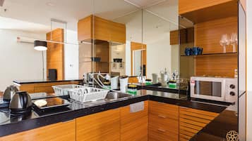 Microwave, electric kettle, cleaning supplies