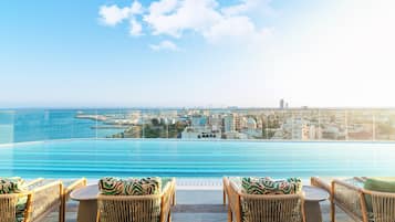 Outdoor pool, pool umbrellas, sun loungers