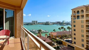 A balcony with a view of a marina and cityscape. - Belle Harbor  803-M - Panoramic Views (Clearwater Beach)