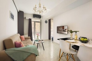 Executive Apartment, 1 Bedroom | Living area | 40-inch flat-screen TV with cable channels, pay movies