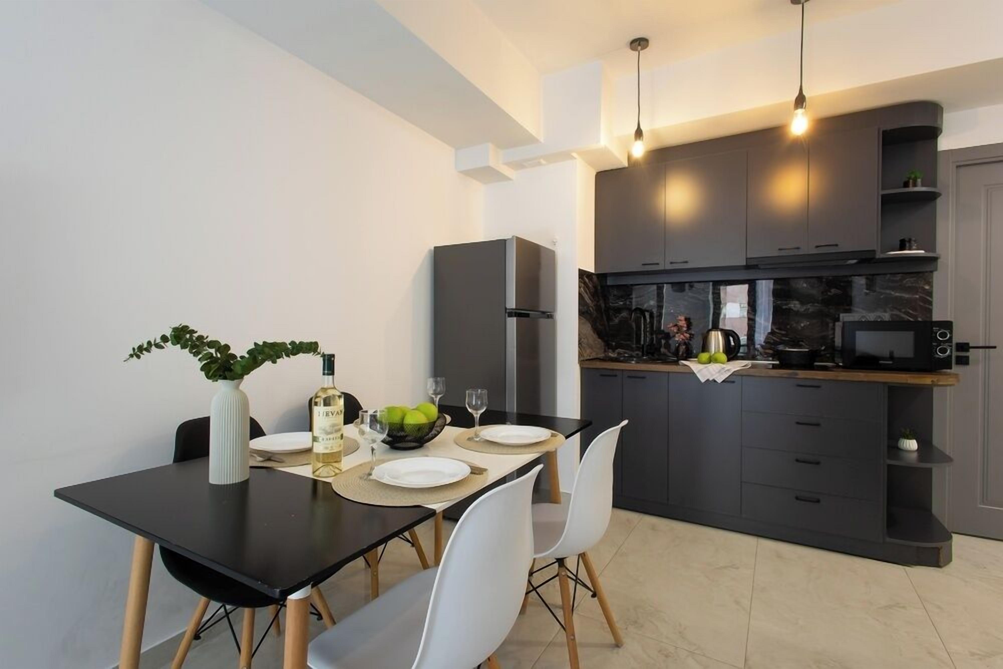 Executive Apartment, 1 Bedroom | Private kitchen | Fridge, microwave, coffee/tea maker, electric kettle