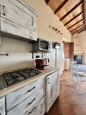Fridge, microwave, stovetop, coffee/tea maker