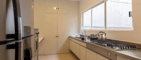 Fridge, microwave, stovetop, coffee/tea maker