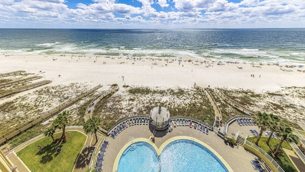 A beach resort with a large swimming pool, beach area, and a view of the ocean. - Summer House 1105A (Orange Beach)