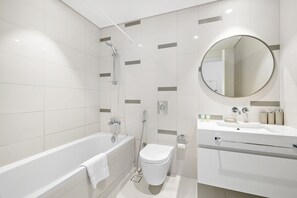Shower, hair dryer, towels, toilet paper