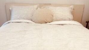 A bed with a white bedspread and two pillows. - Pet friendly fully furnished and private 1 Bedroom Flat (Fond du Lac)