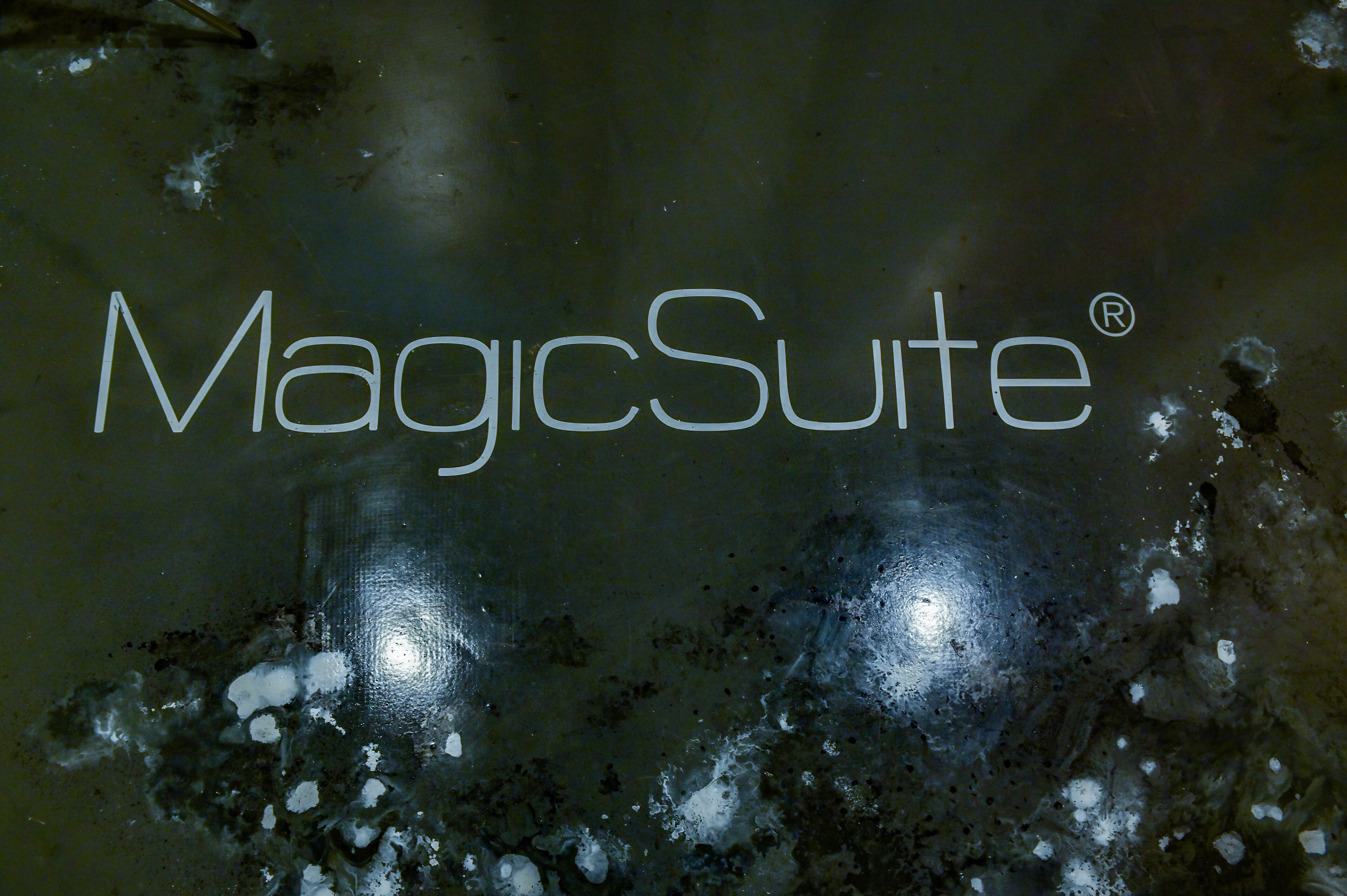 A reflective surface with the text "MagicSuite®" prominently displayed.