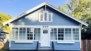 A single-story house with a blue exterior, white trim, and a number '420' on the front. - Modern Comfort in a Bright Nampa Retreat (Nampa)