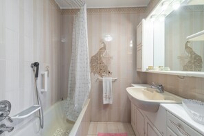Bathtub, hair dryer, towels