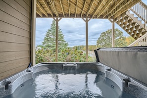 Hot tub on lower level with nice view of Lake Lanier and the marina. 