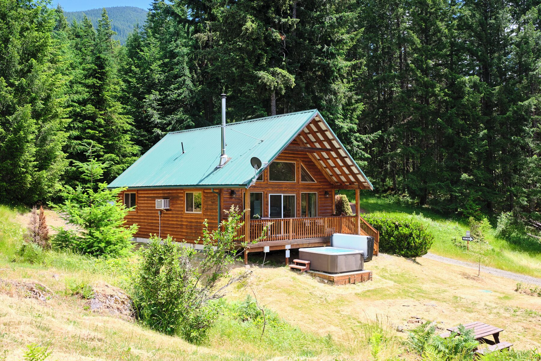 A cozy cabin on a peaceful 0.8-acre lot surrounded by quiet evergreens