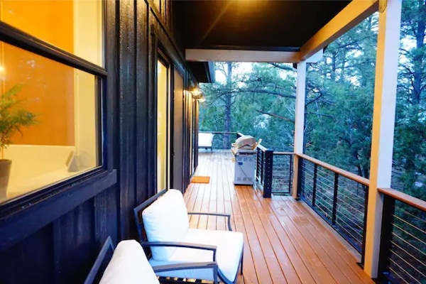 Our deck featured a covered seating area to enjoy the pines and conversation.
