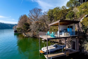 Enjoy a scenic view of the lake from the multi-level deck with outdoor seating.