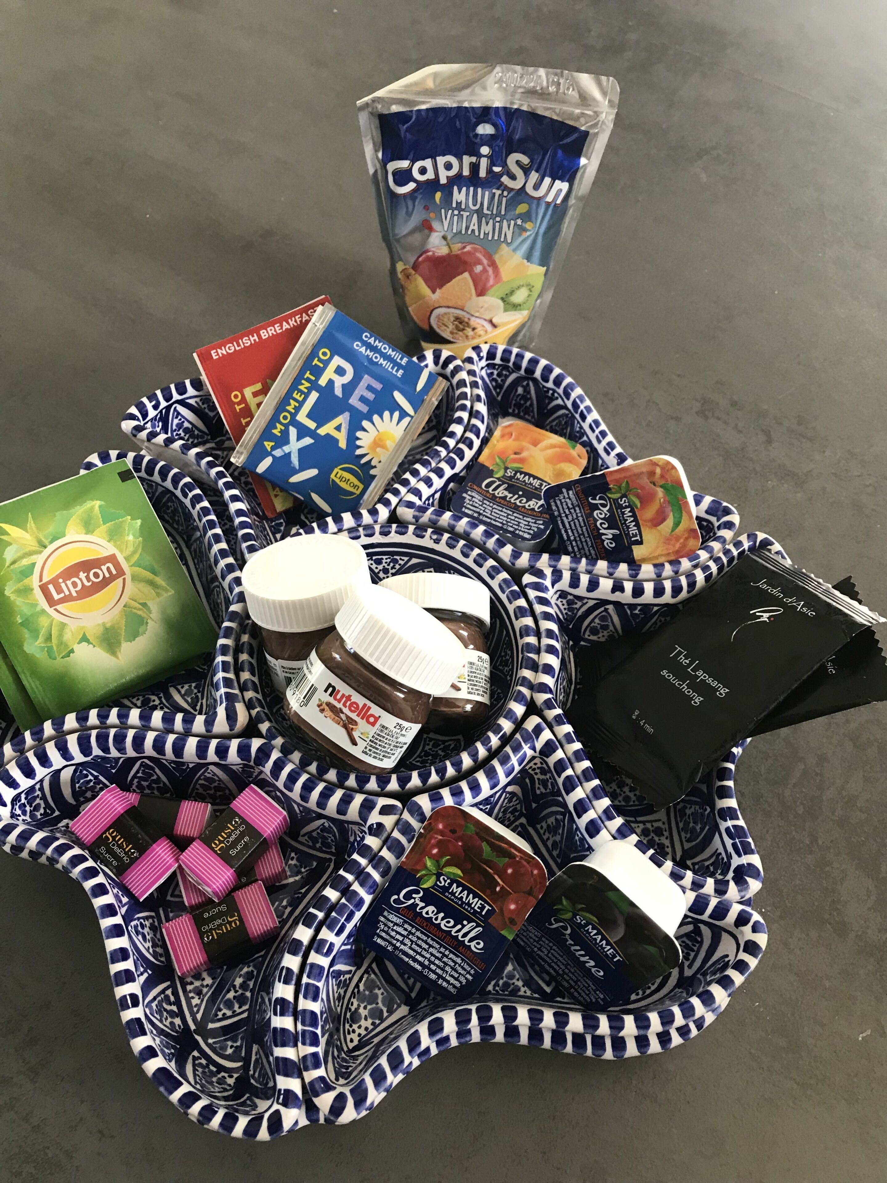 A variety of food items and a book on a table.