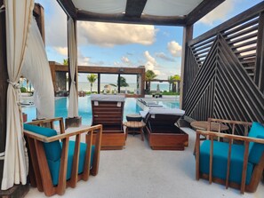 Outdoor pool, a heated pool - PGA Mexico Open/Kingdom of the Sun. Vidanta Grand Luxxe. Luxurious 1BR, 1.5Bath. (Nuevo Vallarta)