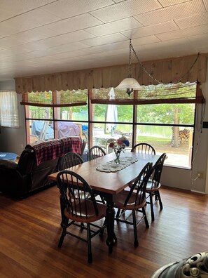 Dining - Cozy Cabin with private river access, 20 minutes from Lake George & Saratoga NY. (Lake Luzerne)