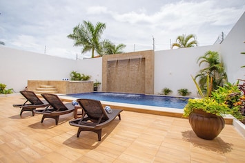 Massive pool, waterfall, and hottub