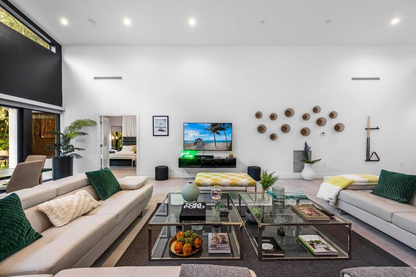 A modern living room with a sofa, coffee table, and TV.