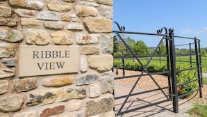 A stone wall with a sign reading "Ribble View". - Ribble View (Clitheroe)